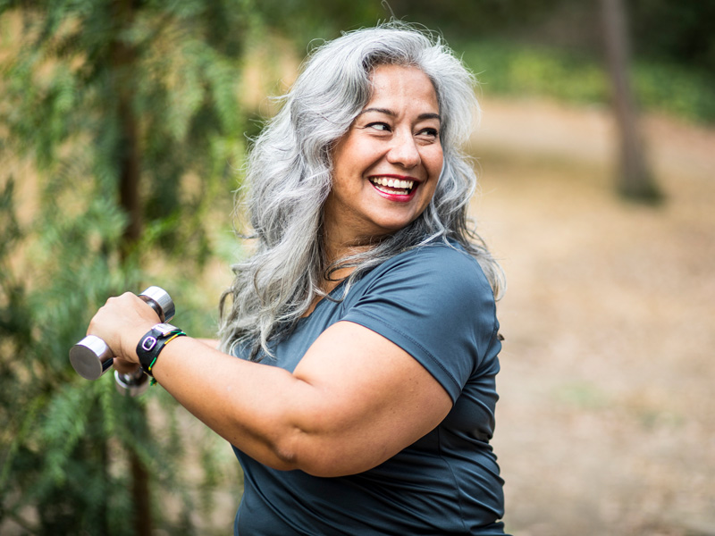 woman exercising with dumbbell 
