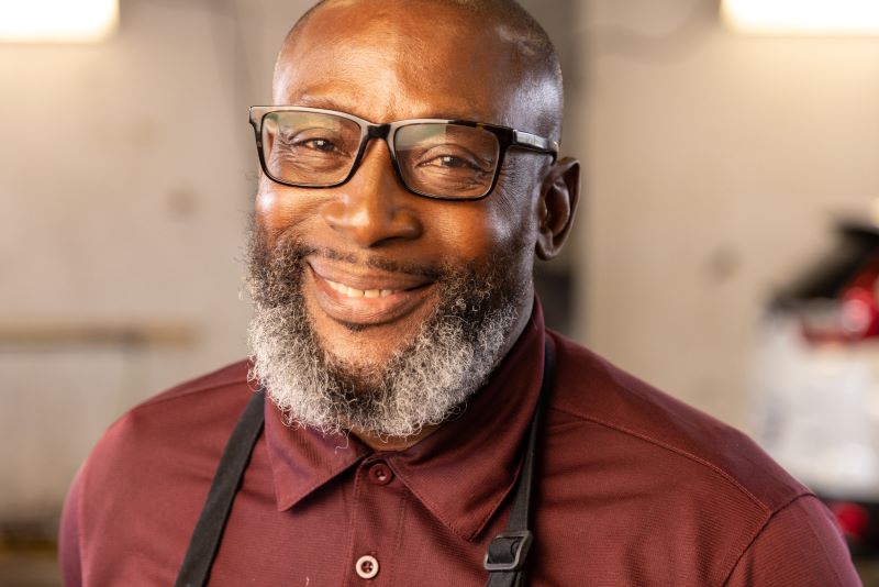 Arnold smiling in black and white photo