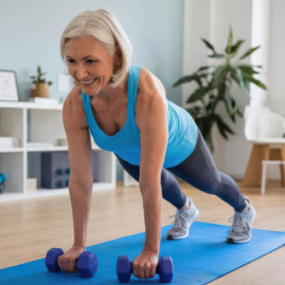 Person wearing blue and working out on a blue mat